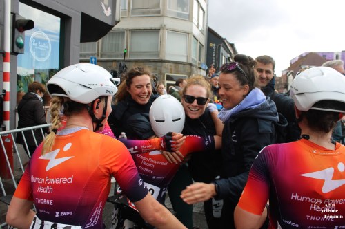 Human Powered Health athletes embrace after the finish line with riders from the team who raced in the Tour of Flanders the previous day.